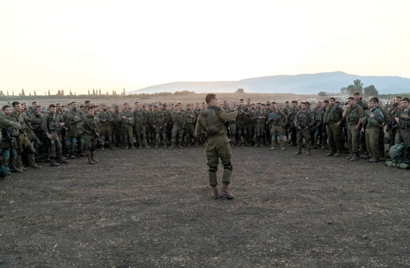  SOLDIERS RECEIVE a briefing from a commander during an IDF exercise. (photo credit: IDF SPOKESPERSON'S UNIT)