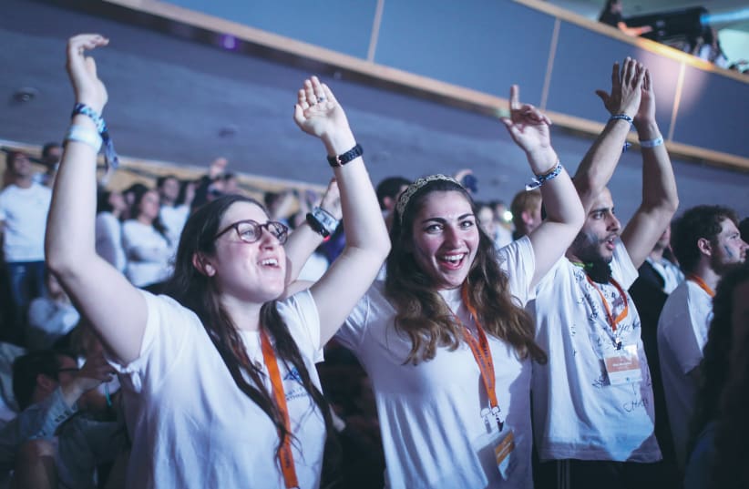  BIRTHRIGHT PARTICIPANTS attend an event at the International Conference Center in Jerusalem in 2015, celebrating ten years since the inception of the program. (photo credit: HADAS PARUSH/FLASH90)