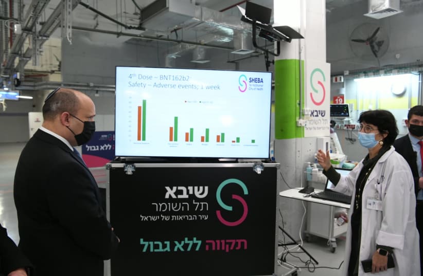  Prime Minister Naftali Bennett visiting Sheba Medical Center as COVID-19 Omicron cases soar in Israel, taken January 4, 2022 (photo credit: AMOS BEN-GERSHOM/GPO)