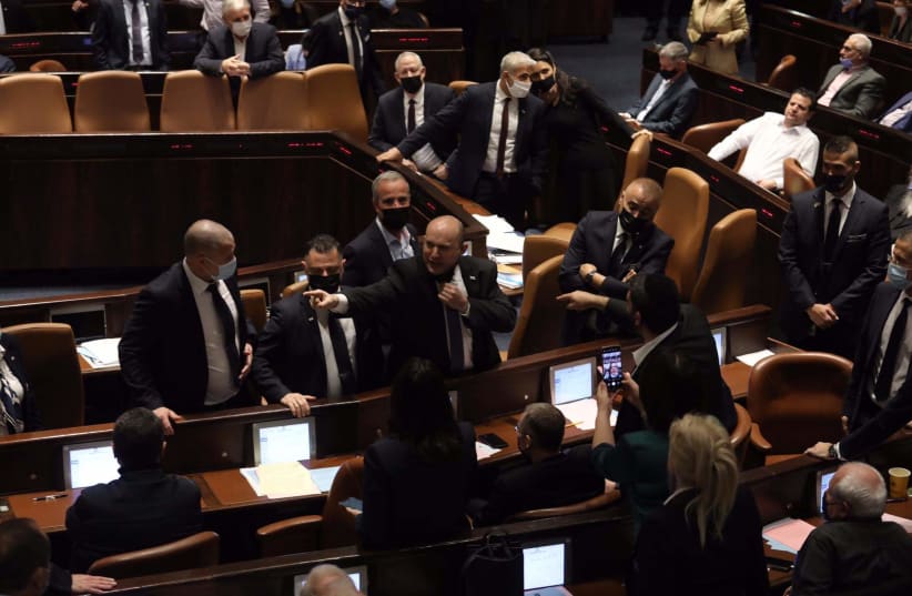  Prime Minister Naftali Bennett yells and points at members of the opposition after the electricity bill is passed, January 2022 (photo credit: MARC ISRAEL SELLEM)