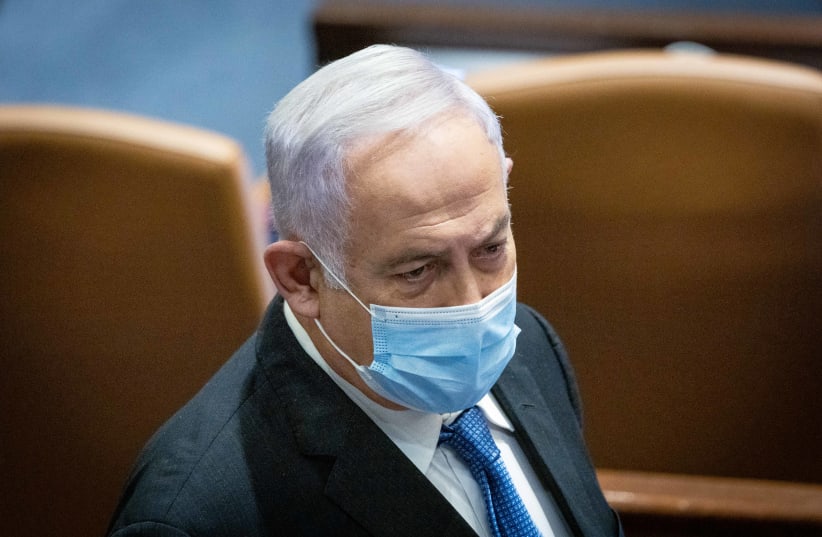  Leader of the Opposition Benjamin Netanyahu seen during a discussion on the Electricity Law connecting to Arab and Bedouin towns, during a plenum session in the assembly hall of the Israeli parliament in Jerusalem, January 5, 2022.  (photo credit: YONATAN SINDEL/FLASH90)