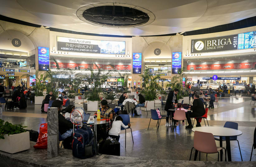  Passengers at the Duty Free in Terminal 3 at the Ben Gurion International Airport near Tel Aviv, on January 4, 2022.  (photo credit: ARIE LEIB ABRAMS/FLASH 90)
