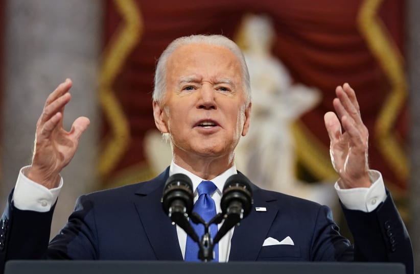 US President Joe Biden speaks in Statuary Hall on the first anniversary of the January 6, 2021 attack on the U.S. Capitol by supporters of former President Donald Trump, on Capitol Hill in Washington, US, January 6, 2022. (photo credit: REUTERS/KEVIN LAMARQUE)