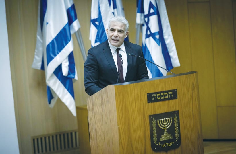  FOREIGN MINISTER Yair Lapid speaks at an event in the Knesset in October marking the first anniversary of the Abraham Accords. (photo credit: YONATAN SINDEL/FLASH90)
