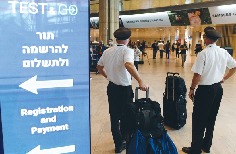 Travelers arrive at Ben-Gurion Airport when Israel again permitted tourists to enter the country on November 1. (photo credit: TOMER NEUBERG/FLASH90)