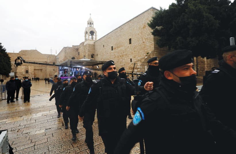Palestinians boost security ahead of Christmas Eve in Bethlehem last month. (photo credit: MOHAMAD TOROKMAN/REUTERS)
