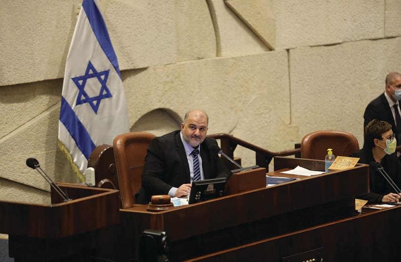 Deputy Knesset Speaker Mansour Abbas (Ra’am-United Arab List) heads a Knesset plenum session this week. Arab-Israelis have been members of every Knesset, yet anti-Israel activists have been pushing the apartheid libel for at least 20 years. (photo credit: MARC ISRAEL SELLEM/THE JERUSALEM POST)