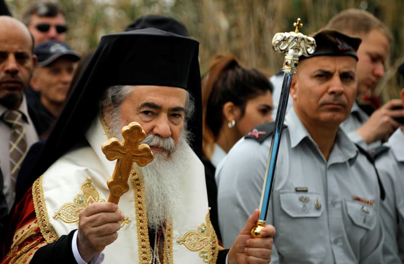  Theophilos III, the Greek Orthodox Patriarch of Jerusalem, arrives to participate in a baptism ceremony at the Jordan River, near Jericho in the West Bank January 18, 2020.  (photo credit: REUTERS/RANEEN SAWAFTA)