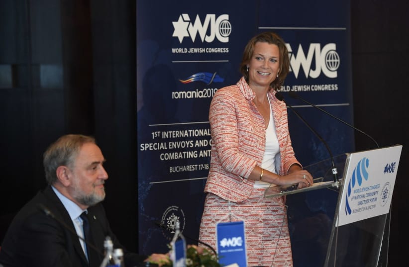  Katharina von Schnurbein speaks at a conference of antisemitism envoys in Bucharest, Romania, June 17, 2019. At left is Robert Singer, executive vice president of the World Jewish Congress, an organizer of the conference. (photo credit: Shahar Azran/World Jewish Congress/JTA)