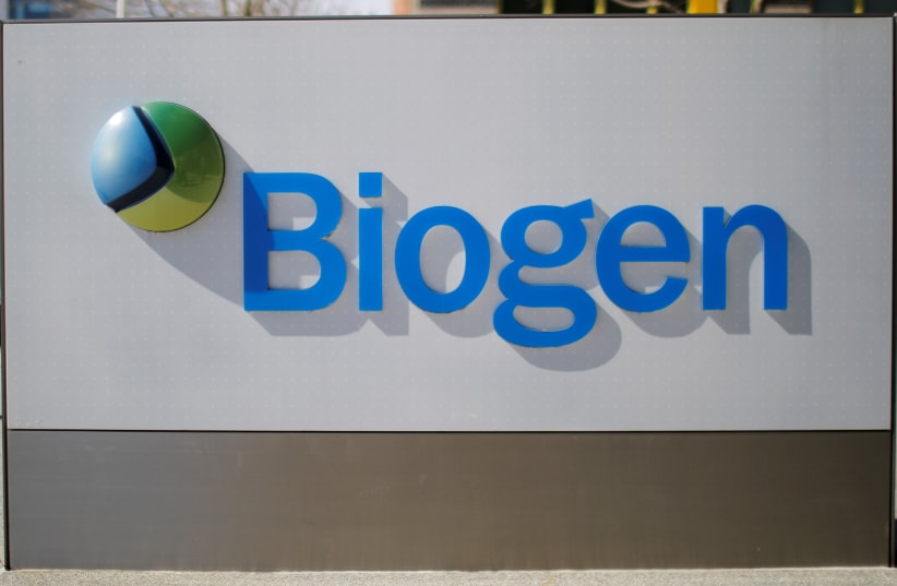 A sign marks a Biogen facility, some of whose employees have tested positive for the coronavirus after attending a meeting in Boston, in Cambridge, Massachusetts, US, March 9, 2020. (photo credit: REUTERS/BRIAN SNYDER/FILE PHOTO)