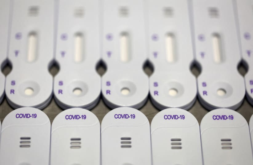  COVID-19 tests are pictured at the NG Biotech factory in Guipry-Messac as France experiences a surge in coronavirus disease (COVID-19) cases due to the Omicron variant, France, January 12, 2022. (photo credit: REUTERS/STEPHANE MAHE)
