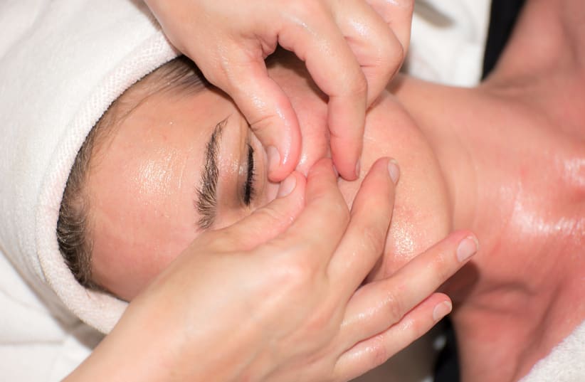  A woman receives treatment for her skin with a facial (Illustrative) (photo credit: PIXABAY)