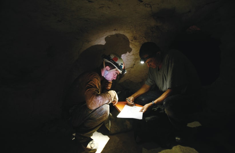  RESEARCHERS INSIDE an archaeological site near Beit Guvrin, 2011. The protagonist-girl goes on an adventurous dig in the area. (photo credit: BAZ RATNER/REUTERS)