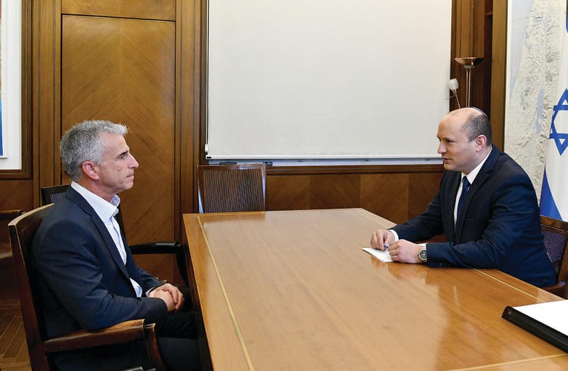 Prime Minister Naftali Bennett and Mossad chief David Barnea meet at the Prime Minister’s Office last June. (photo credit: HAIM ZACH/GPO)