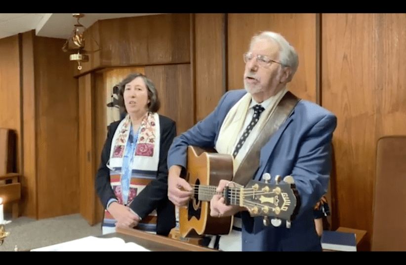  Rabbi Susan Abramson (left) and Cantorial Soloist Ben Silver of Temple Shalom Emeth in Burlington, Mass. lead a prerecorded Friday night service on Jan. 7, 2022. (photo credit: YOUTUBE SCREENSHOT)