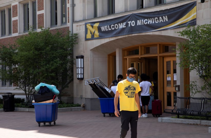 Students move back into the dorm for fall semester amid the coronavirus disease (COVID-19) pandemic at the University of Michigan campus in Ann Arbor, Michigan, US, August 19, 2020. (photo credit: REUTERS/EMILY ELCONIN)