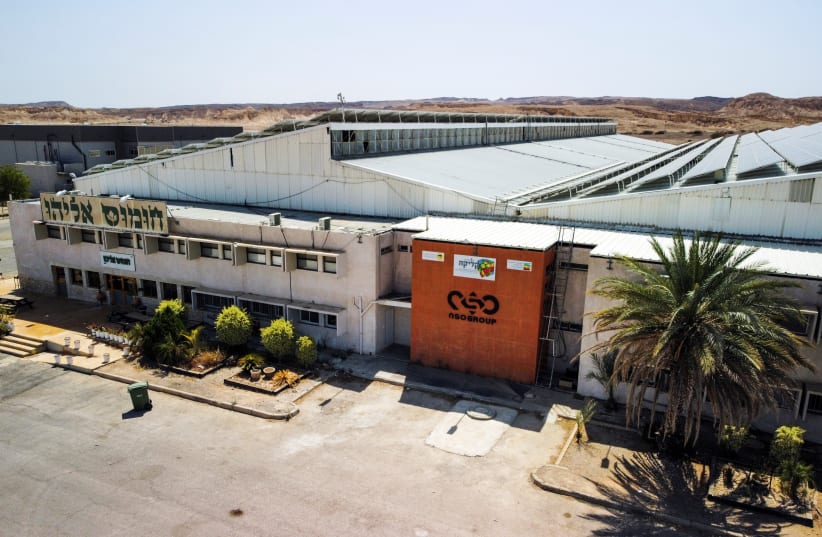 An aerial view shows the logo of Israeli cyber firm NSO Group at one of its branches in the Arava Desert, southern Israel, July 22, 2021. (photo credit: REUTERS/AMIR COHEN)