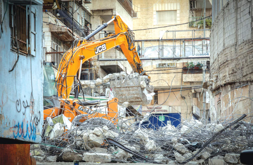  THE JERUSALEM MUNICIPALITY demolishes shops in Shuafat in 2018 on the grounds that they were built without a permit.  (photo credit: SLIMAN KHADER/FLASH90)