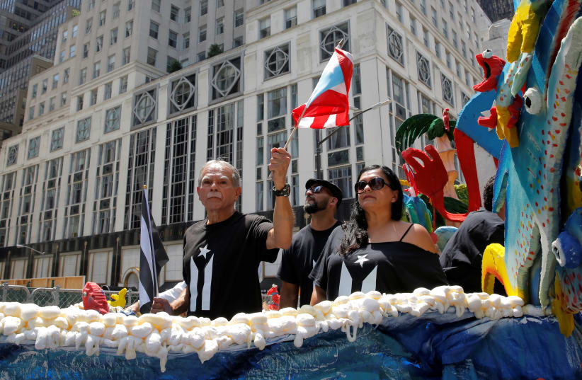  PARDONED FALN terrorist-activist Oscar Lopez Rivera travels along Fifth Avenue during the 2017 Puerto Rican Day Parade, New York. (photo credit: Andrew Kelly/Reuters)