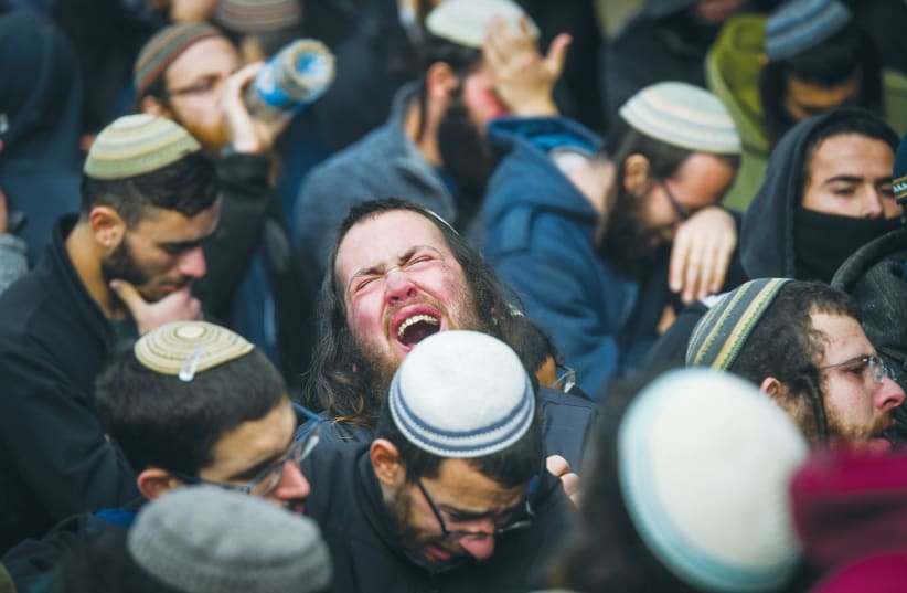  MOURNERS ATTEND the funeral of Yehuda Dimentman at the West Bank hilltop of Homesh last month. He was killed in a terrorist attack.  (photo credit: FLASH90)