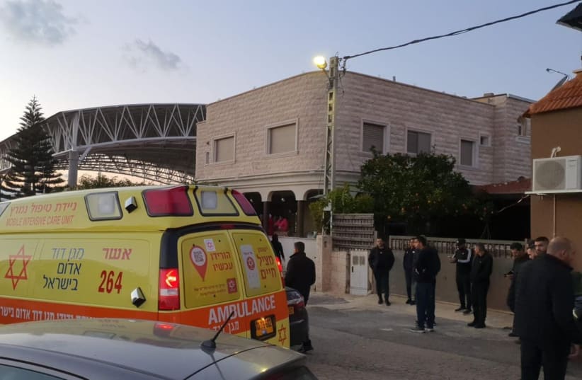  An MDA ambulance is seen outside the Jadeidi-Makr house on January 22, 2021 (photo credit: MAGEN DAVID ADOM)