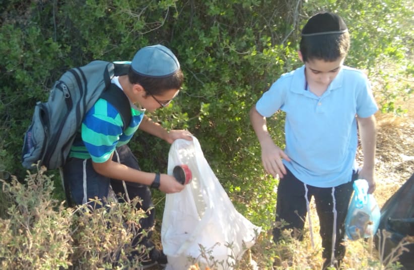 Children participate in an activity of Leshomra, likely the largest Haredi environmental organization currently operating in Israel. (photo credit: COURTESY LESHOMRA)
