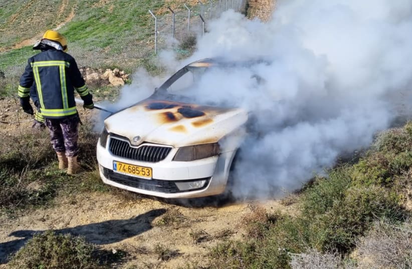  A car is seen aflame after Jewish settler extremists attacked near the village of Burin in the West Bank. (photo credit: YESH DIN)