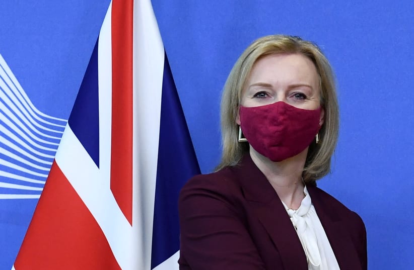 British Foreign Secretary Liz Truss gets welcomed by European Commission vice-president in charge for 'Interinstitutional Relations and Foresight' (not in the picture) before their bilateral meeting at the EU headquarters in Brussels, Belgium, January 24, 2022.  (photo credit: JOHN THYS/POOL VIA REUTERS)