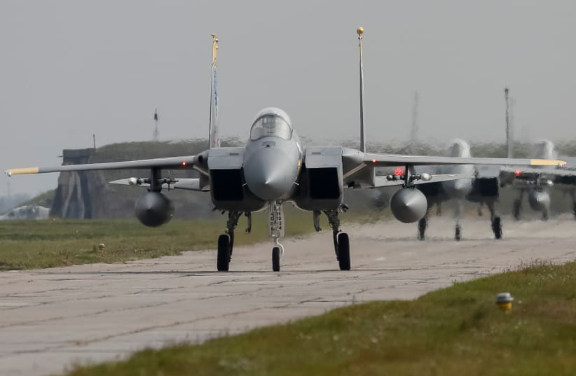  US Air Force F-15 fighter jets are seen on the tarmac during the Clear Sky 2018 multinational military drills at Starokostiantyniv Air Base in Khmelnytskyi Region, Ukraine October 12, 2018. (photo credit: GLEB GARANICH/REUTERS)