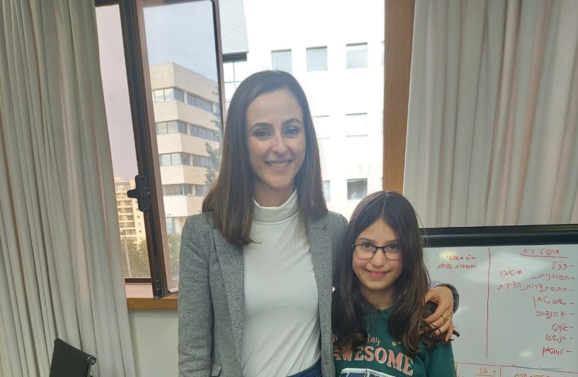  Minister of Social Equality and Pensioners Meirav Cohen poses for a photograph with nine-year-old Meirav, the writer's granddaughter (photo credit: Shoshana Tita)
