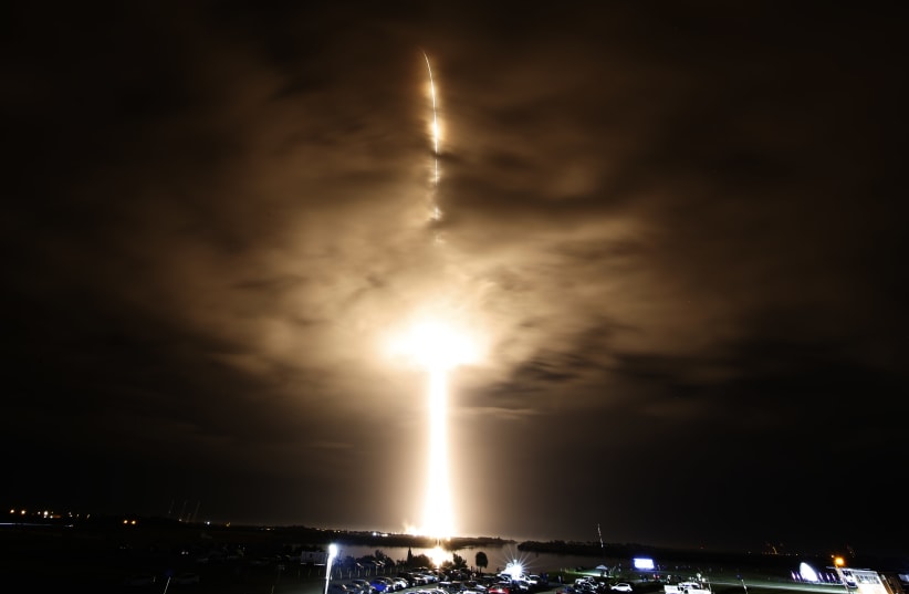  A SpaceX Falcon 9 rocket, with the Crew Dragon capsule, is launched carrying three NASA and one ESA astronauts on a mission to the International Space Station at the Kennedy Space Center in Cape Canaveral, Florida, US, November 10, 2021.  (photo credit: JOE SKIPPER/REUTERS)