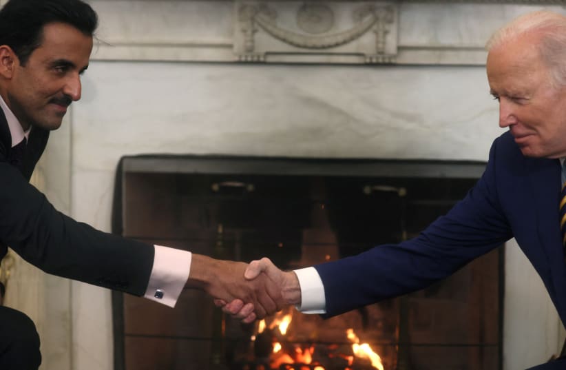  Qatar's Emir Sheikh Tamim bin Hamad Al Thani shakes hands with US President Joe Biden during a bilateral meeting in the Oval Office at the White House in Washington, US, January 31, 2022.  (photo credit: LEAH MILLIS/REUTERS)