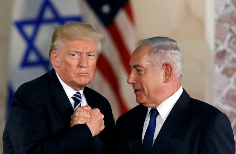 U.S. President Donald Trump and Israeli Prime Minister Benjamin Netanyahu shake hands after Trump's address at the Israel Museum in Jerusalem (photo credit: REUTERS/Ronen Zvulun)