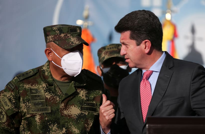  Colombia's Defense Minister Diego Molano speaks with the Commander of the Colombian Military Forces, General Luis Fernando Navarro (photo credit: LUISA GONZALEZ/REUTERS)