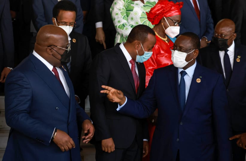 President of the Democratic Republic of Congo Felix Tshisekedi, Ethiopia's Prime Minister Abiy Ahmed, and President of Senegal Macky Sall prepare for a group photo during the opening ceremony of the 35th ordinary session of the Assembly of the African Union at the African Union Commission. (photo credit: REUTERS/TIKSA NEGERI)