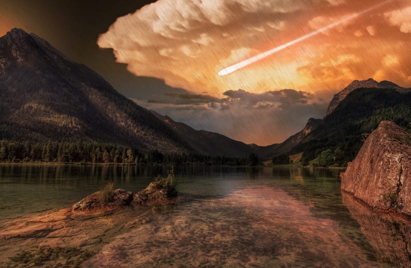  A comet is seen heading for a mountainous area in this artistic illustration. (photo credit: PIXABAY)