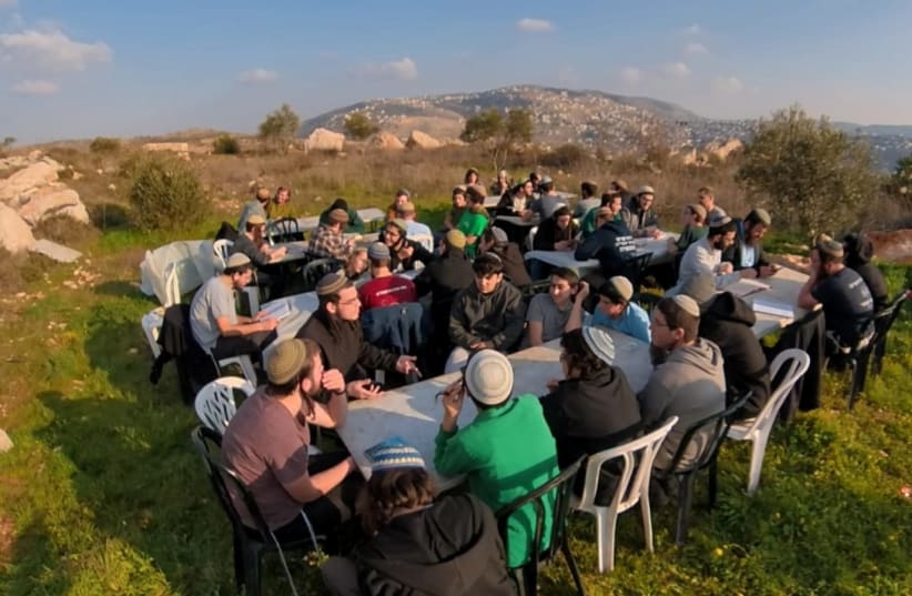  Settlers and right-wing activists hold a study session at the Evyatar outpost, to demand that the Defense Minister Benny Gantz allow a yeshiva to be opened at the site. (photo credit: Courtesy)