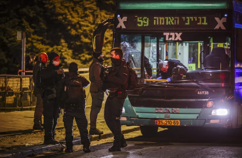  Police officers at the scene of a shooting attack in Jerusalem, February 9, 2022 (photo credit: YONATAN SINDEL/FLASH90)