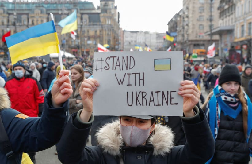  People take part in the Unity March, which is a procession to demonstrate Ukrainians' patriotic spirit amid growing tensions with Russia, in Kyiv, Ukraine February 12, 2022. (photo credit: REUTERS/VALENTYN OGIRENKO)