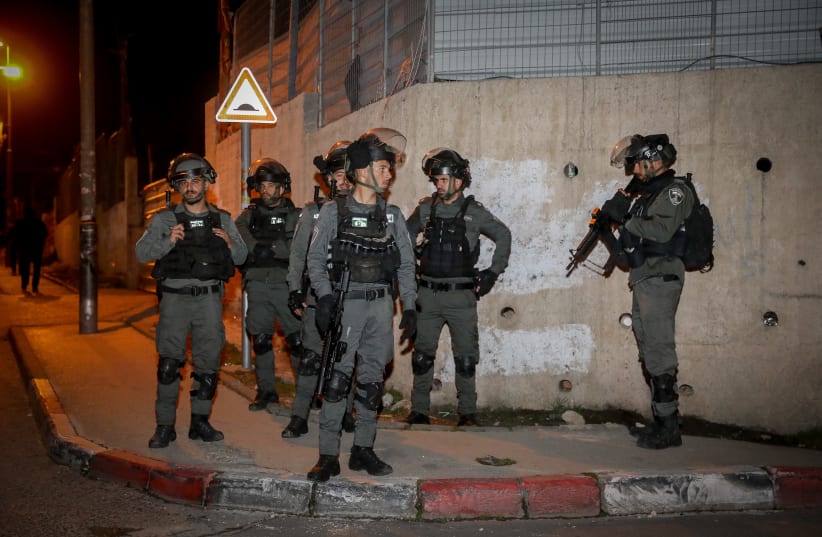  Israeli border police officers guard during riots in the East Jerusalem neighborhood of Sheikh Jarrah, February 13, 2022. (photo credit: NOAM REVKIN FENTON/FLASH90)