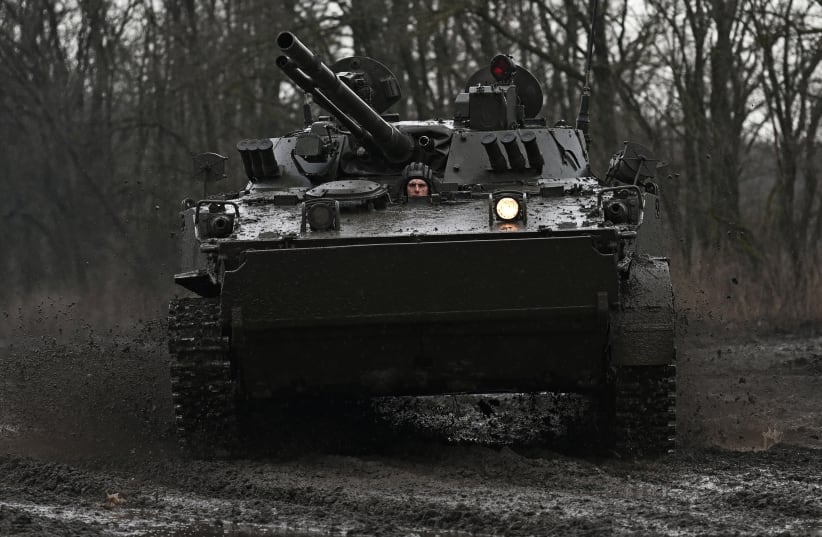  A Russian service member drives a BMP-3 infantry fighting vehicle during drills held by the armed forces of the Southern Military District at the Kadamovsky range in the Rostov region, Russia February 3, 2022. (photo credit: REUTERS/SERGEY PIVOVAROV)