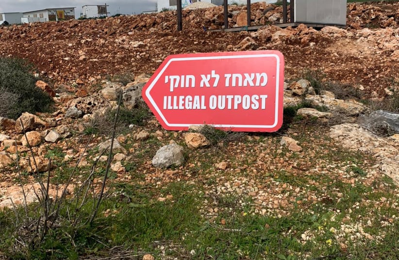  A sign outside the Evyatar outpost put up by left-wing protesters reads "illegal outpost," February 17, 2022. (photo credit: PEACE NOW)
