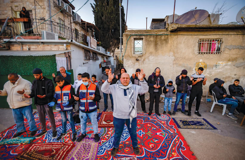  PALESTINIAN PROTESTERS gather in the Sheikh Jarrah neighborhood, February 14. (photo credit: YOSSI ZAMIR/FLASH90)