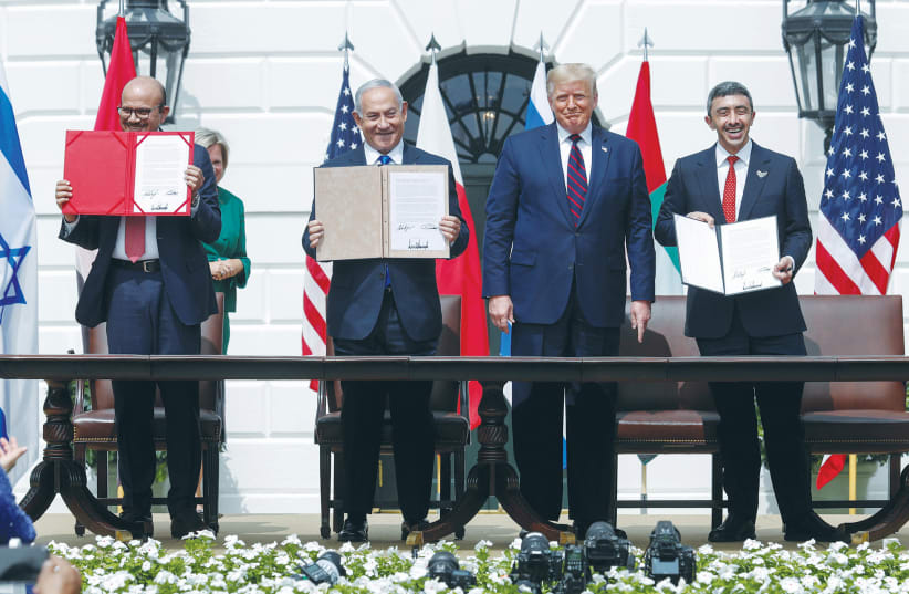  THEN-US PRESIDENT Donald Trump hosts the signing of the Abraham Accords by Israel, UAE and Bahrain at the White House in September 2020. (photo credit: TOM BRENNER/REUTERS)