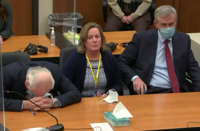 Former police officer Kimberly Potter sits with her defense lawyers after she was found guilty of first degree and second degree manslaughter in a still image from video in Minneapolis, Minnesota, US, December 23, 2021. (photo credit: POOL VIA REUTERS)