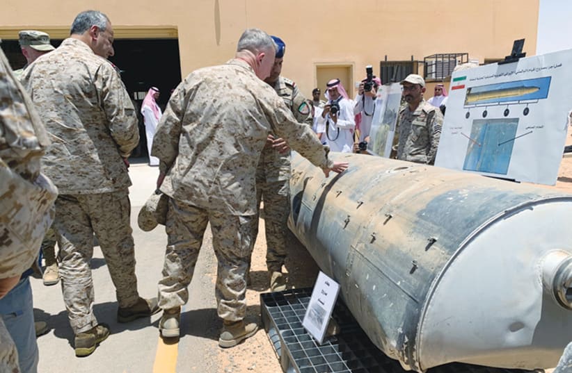  SAUDI ARABIAN-led coalition officials show US Central Command chief General Kenneth McKenzie an exhibit of missiles and other weapons said to be used in Houthi attacks against Saudi Arabia, in Riyadh in 2019. (photo credit: REUTERS/MARWA RASHAD)