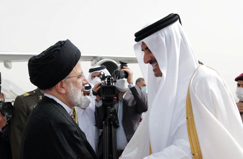 Qatar's Emir Sheikh Tamim bin Hamad Al-Thani receives Iran's President Ebrahim Raisi, in Doha, Qatar, February 21, 2022. (photo credit: QATAR NEWS AGENCY/HANDOUT VIA REUTERS)
