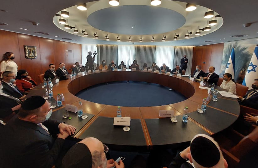  Israel's Prime Minister Naftali Bennett is seen meeting with the Orthodox Jewish umbrella organization Am Echad, on February 23, 2022. (photo credit: Noam Weiss)