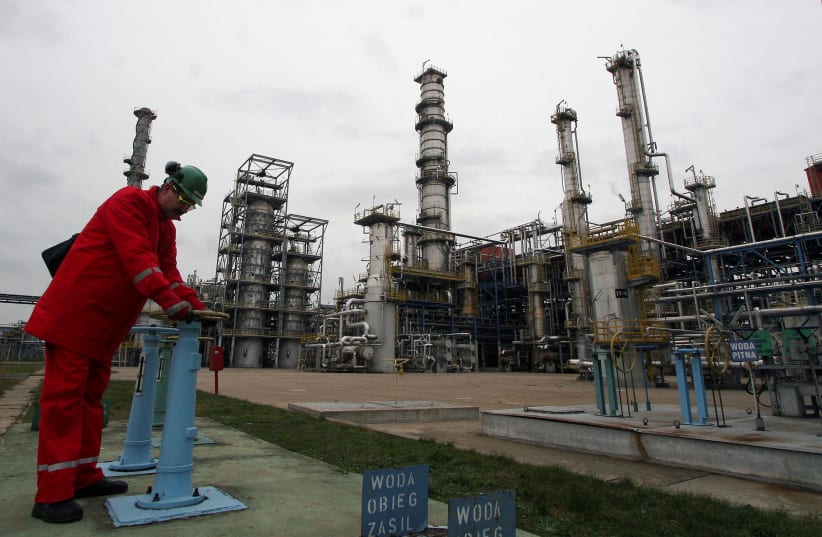   A man works at the PKN Orlen main oil refinery in Plock January 11, 2007. Photo taken January 11, 2007.  (photo credit: PETER ANDREWS / REUTERS)