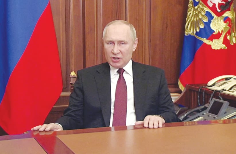  RUSSIAN PRESIDENT Vladimir Putin delivers a special address Thursday on Russian state TV, authorizing a military operation in Ukraine’s Donbass region.  (photo credit: REUTERS TV)